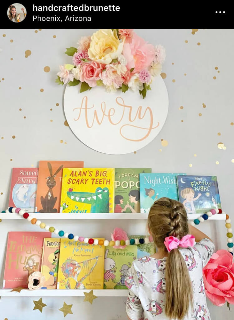 girl with flower headboard as a best bookshelf ideas for kids